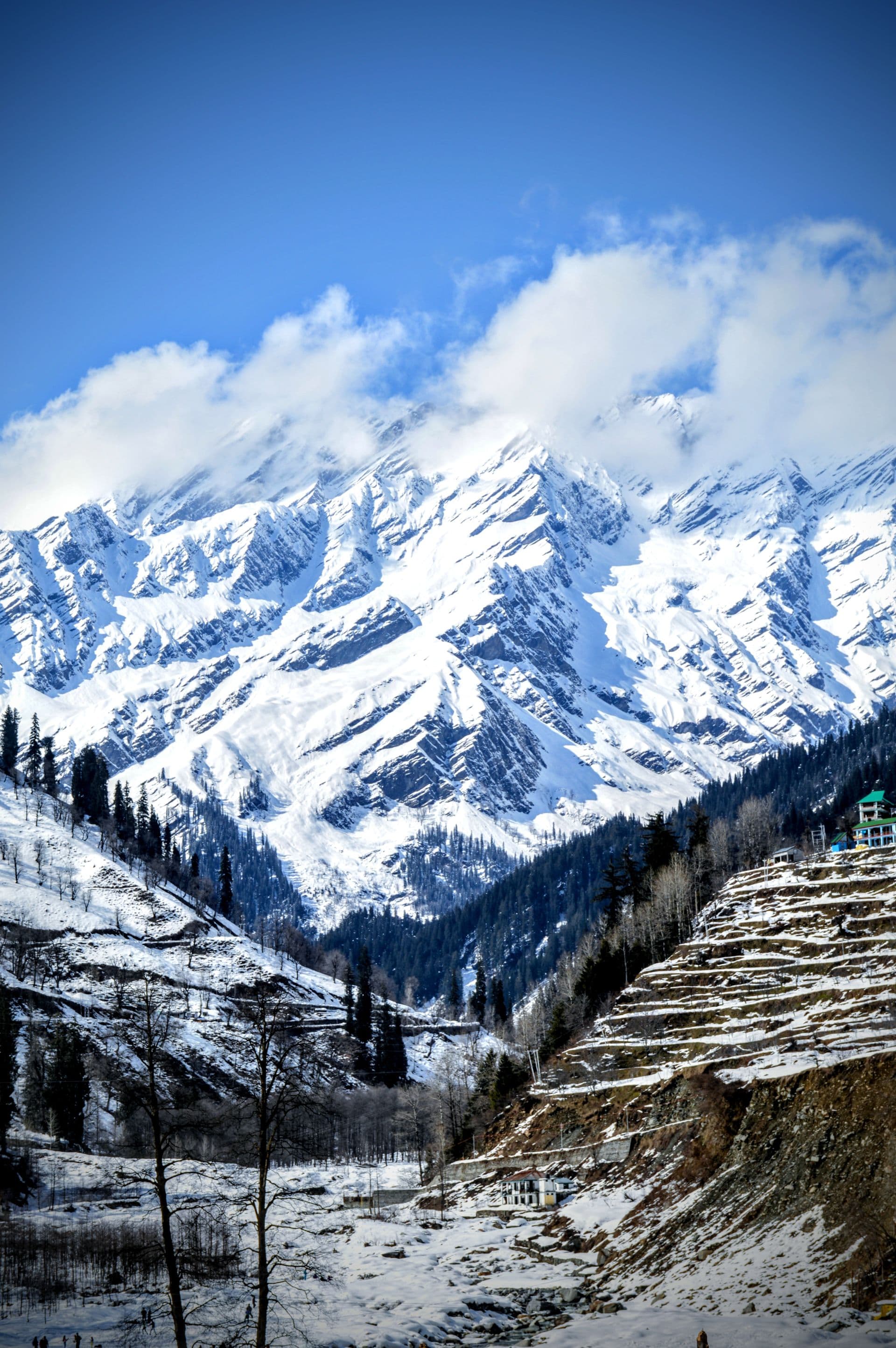 The road to the Atal Tunnel cutting through the mountains