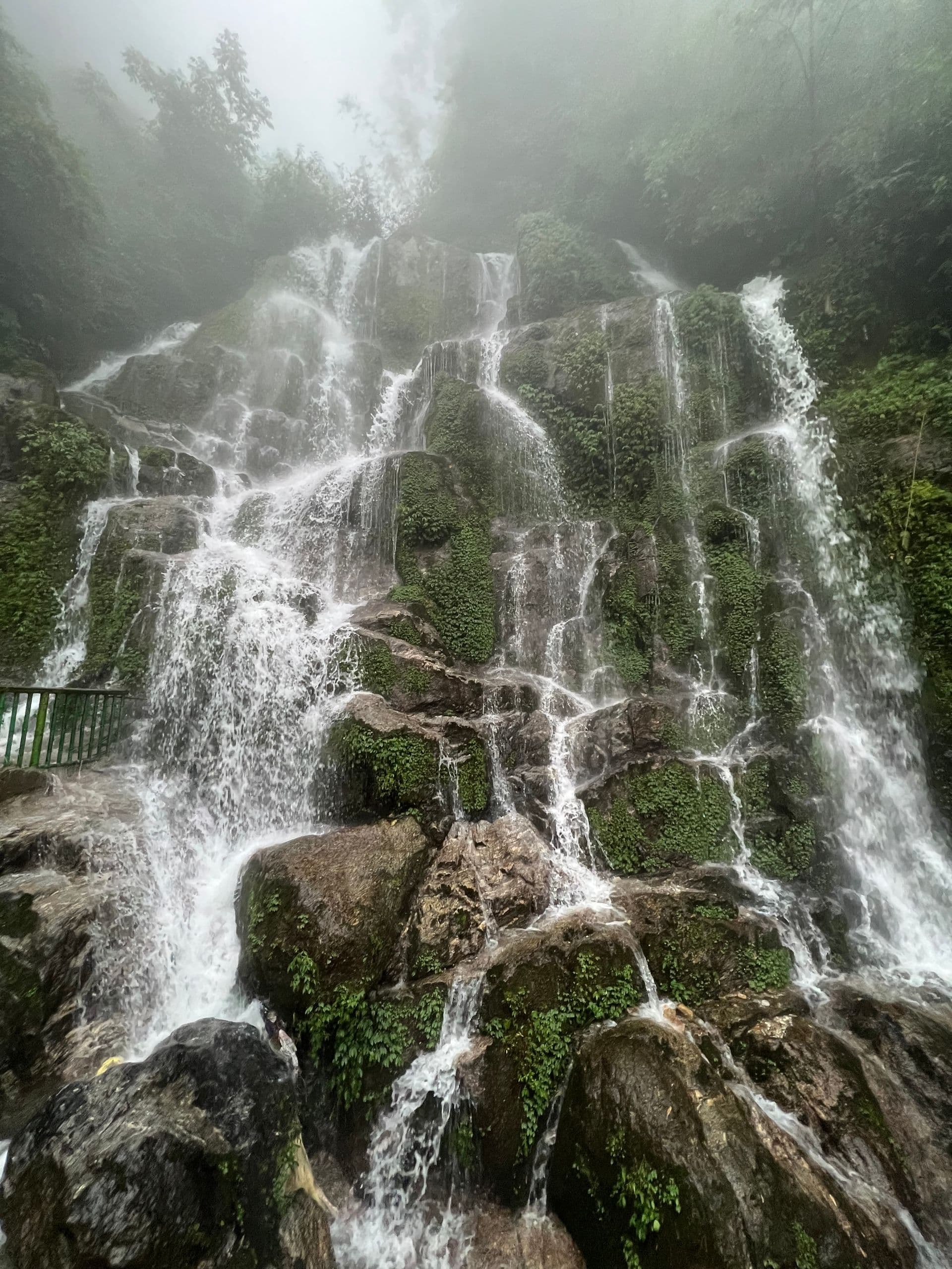 Misty cascades near Bhagsu at sunrise