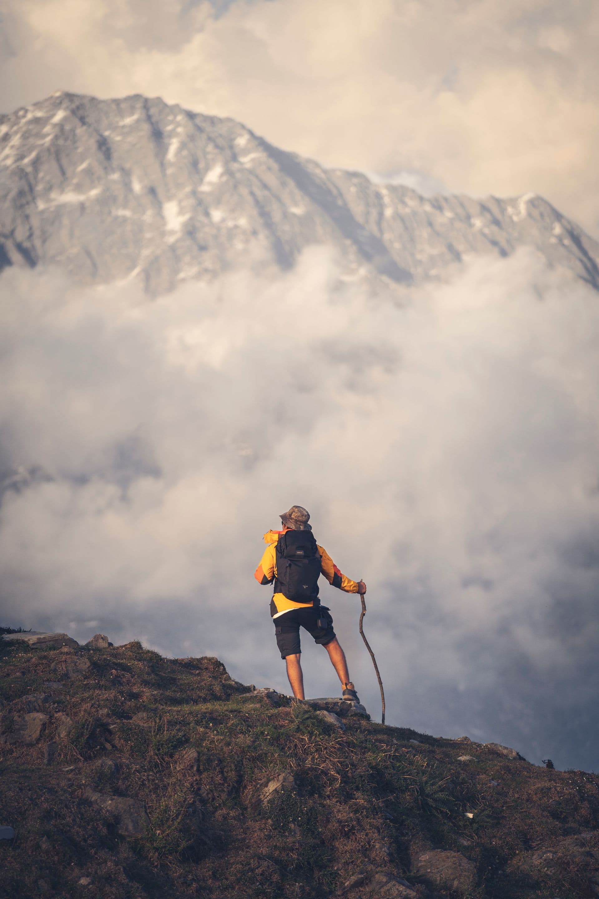 Trekker above the clouds on the Triund trail