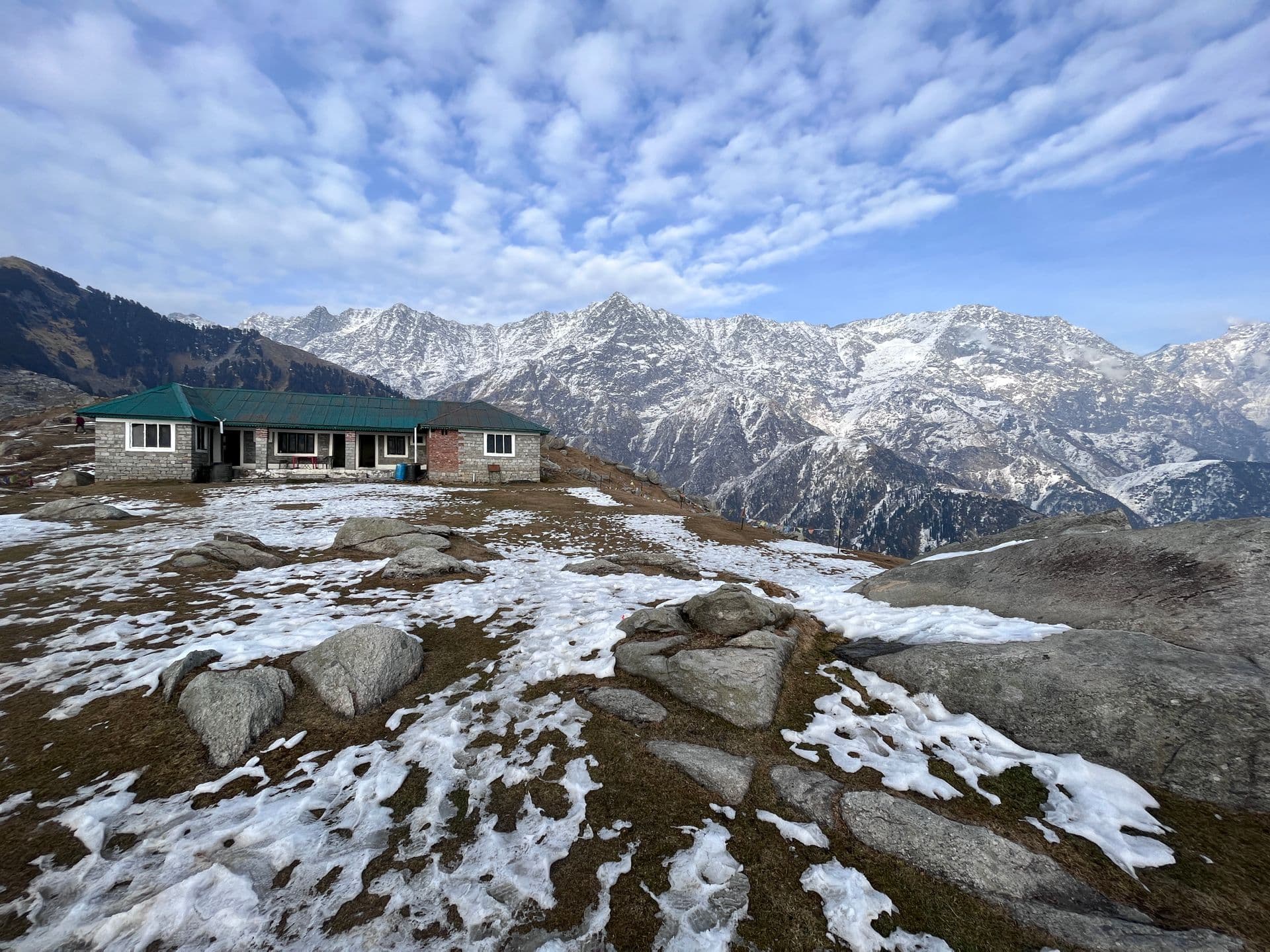 Snow patches on Triund top with the Dhauladhar behind