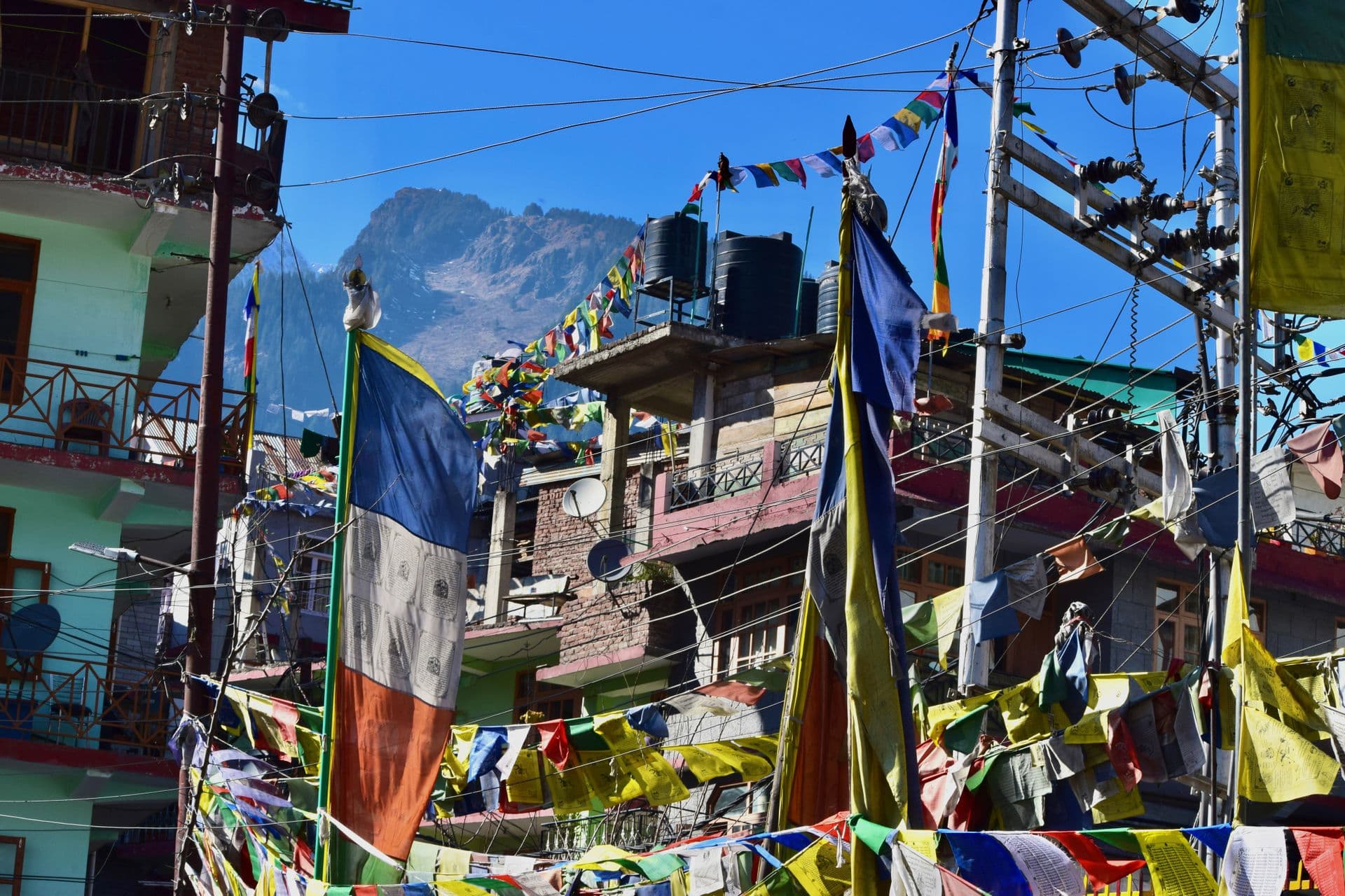 Prayer flags strung over a McLeod Ganj street