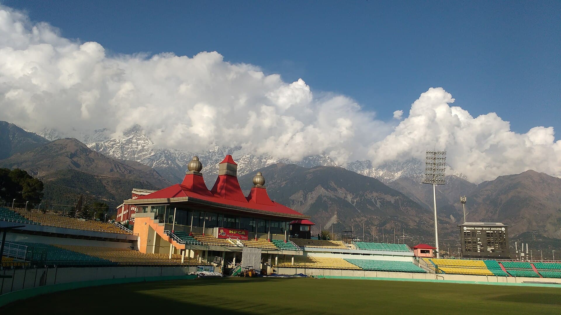 Dharamshala cricket stadium with the Dhauladhar behind